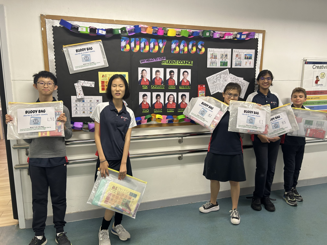 Terence, Jio, Anya and Azeen are creating a display to show their peers how to use the Buddy Bags